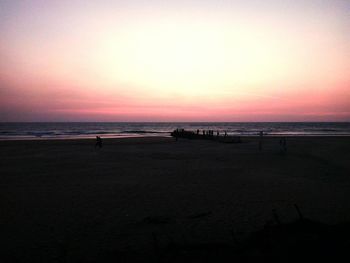 Scenic view of beach against sky during sunset