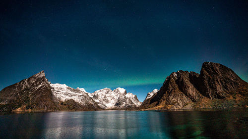 Scenic view of sea against sky at night