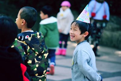 Children playing with flag in background