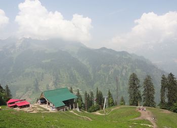 Scenic view of landscape and mountains against sky