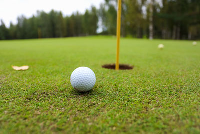 Close-up of golf ball on field