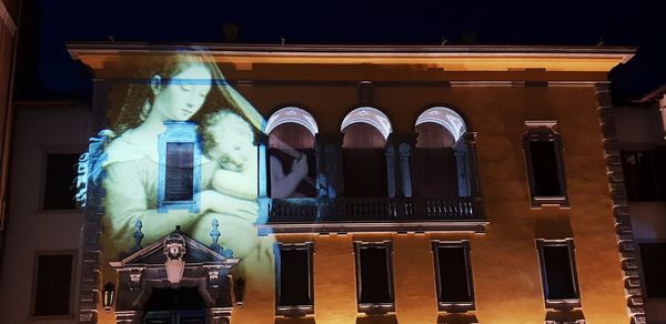 Low angle view of illuminated building at night