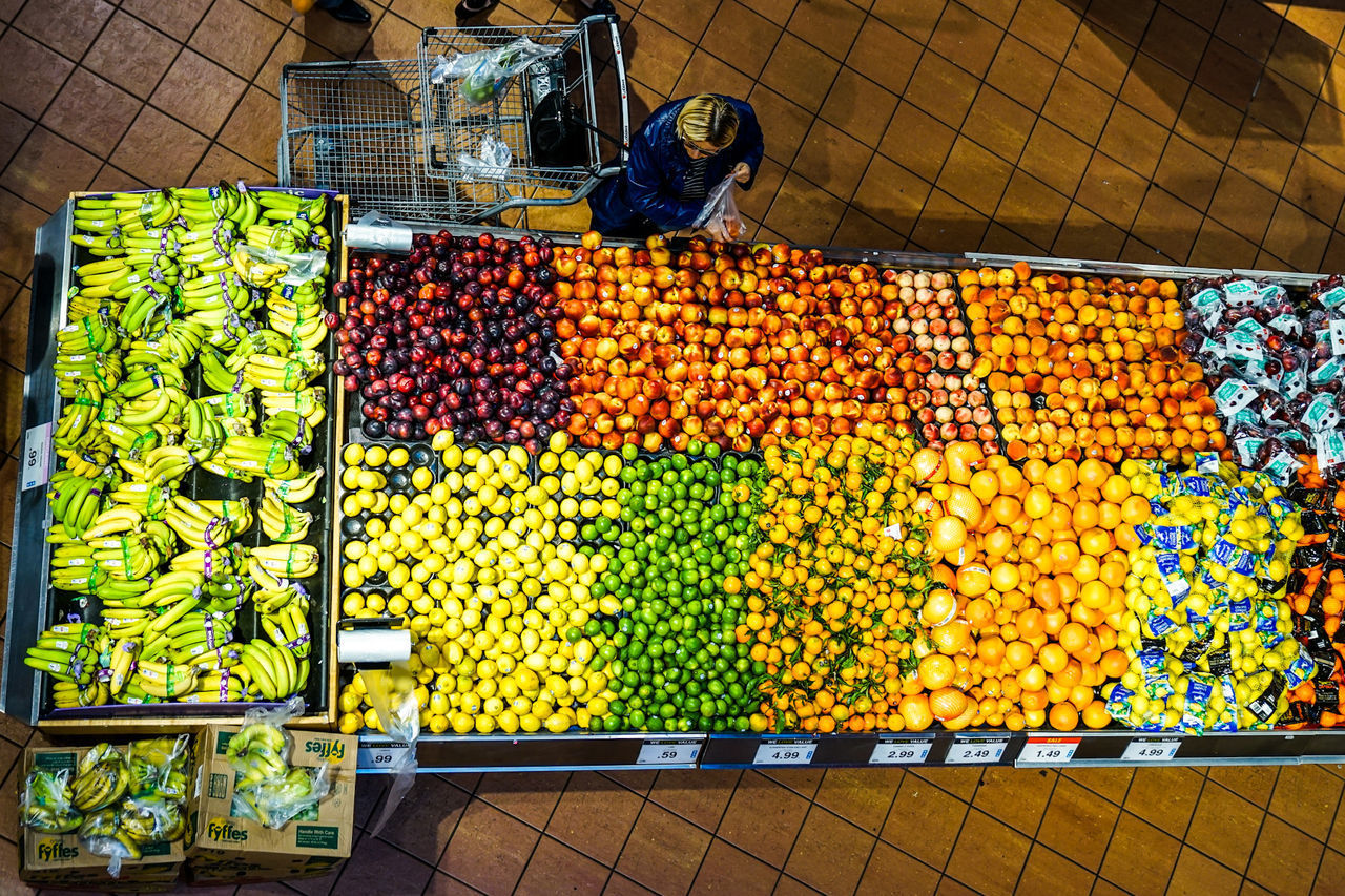 HIGH ANGLE VIEW OF FRUITS AT MARKET STALL