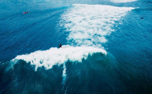 High angle view of man surfing in sea