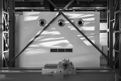 Low angle view of electric lamp on ceiling in building