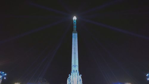 Low angle view of illuminated stage at night