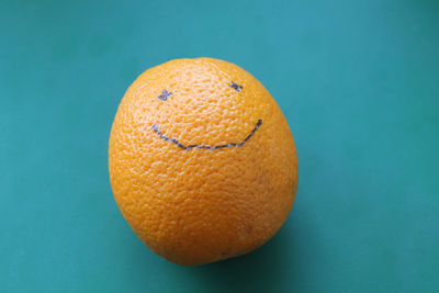 Close-up of oranges against blue background