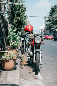 Rear view of man riding motorcycle on road