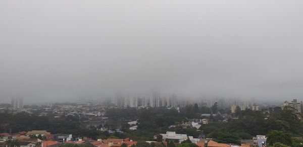 Buildings in city against sky