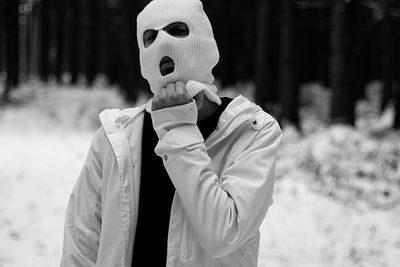 Portrait of man wearing mask while standing outdoors