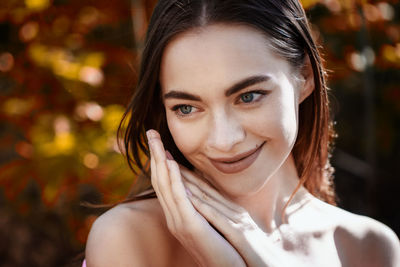 Beauty portrait of a young woman on a natural background