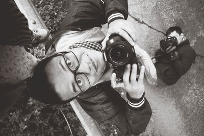 High angle portrait of man photographing