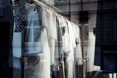 Close-up of clothes drying outside store