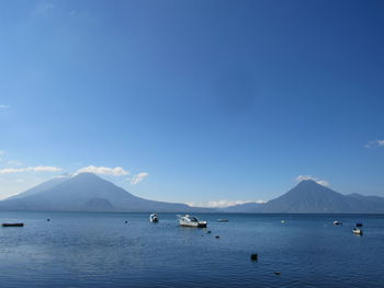 Scenic view of sea against blue sky