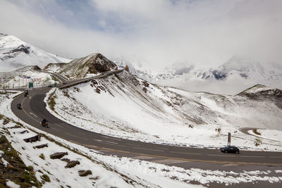 Scenic view of snow covered mountains against sky