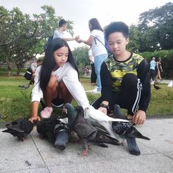 Young couple sitting outdoors