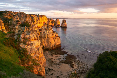 Praia do amado beach at sunset in costa vicentina, portugal