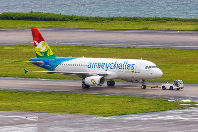 Side view of airplane on runway