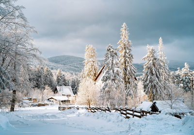 Snow covered mountain village in a sunny winter day