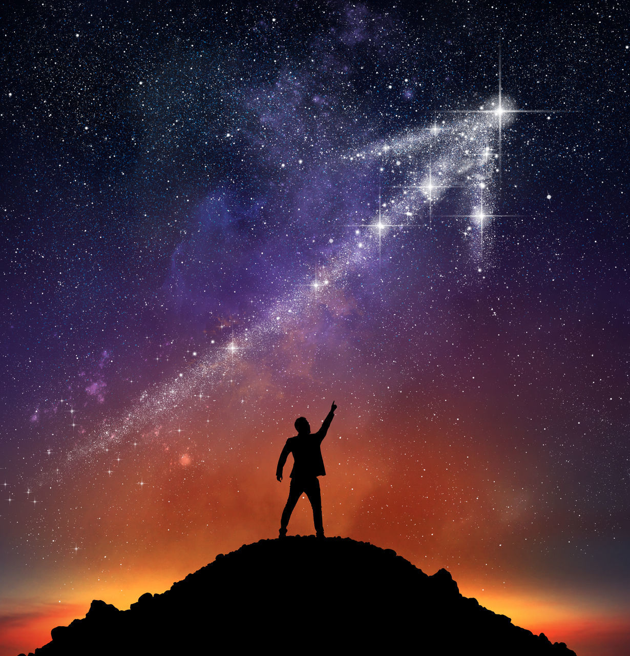 SILHOUETTE MAN STANDING AGAINST STAR FIELD AT NIGHT SKY