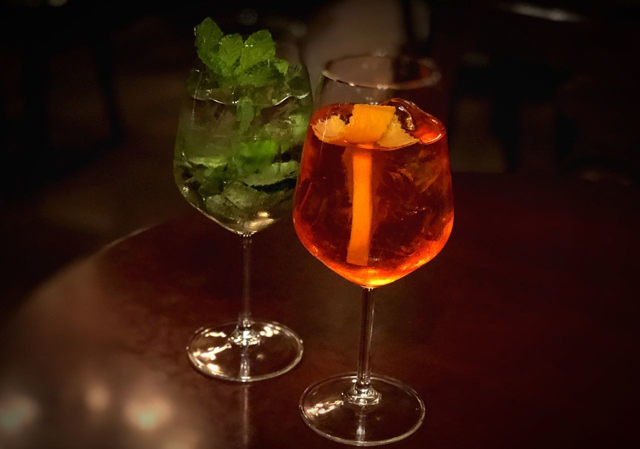 CLOSE-UP OF DRINK ON TABLE WITH ICE