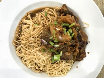 High angle view of pasta in plate on table