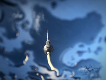 Low angle view of communications tower against sky