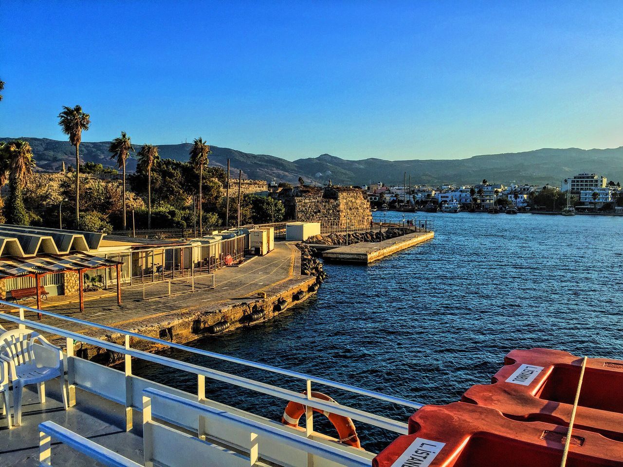 architecture, blue, river, water, building exterior, transportation, city, high angle view, built structure, cityscape, bridge - man made structure, nautical vessel, outdoors, sky, no people, day