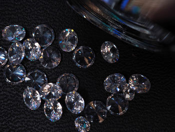 Close-up of coins on glass