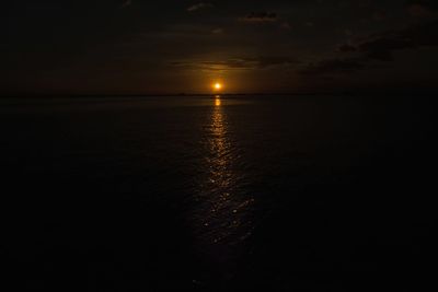 Scenic view of sea against sky at sunset