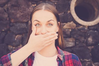 Portrait of young woman standing outdoors