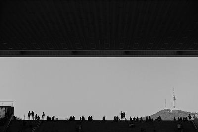 Low angle view of woman standing in city