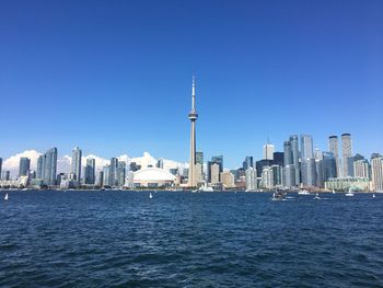 View of buildings in city against clear sky