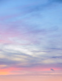 Low angle view of cloudy sky at sunset