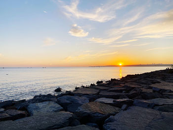 Scenic view of sea against sky during sunset