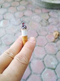 Hand holding cigarette