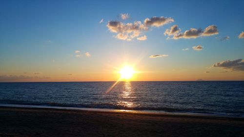 Scenic view of sea against sky at sunset