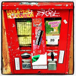 Close-up of red mailbox on wall