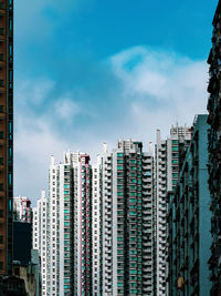 Modern buildings against sky in city