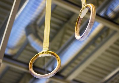 Close-up of gymnastic rings hanging from ceiling