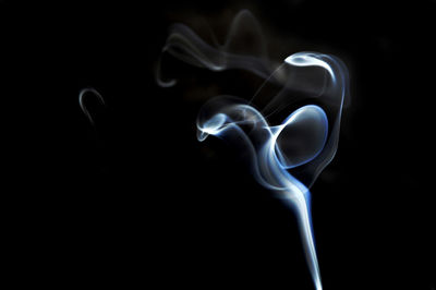 Close-up of smoke against black background