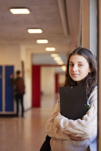 Teenage girl looking at camera