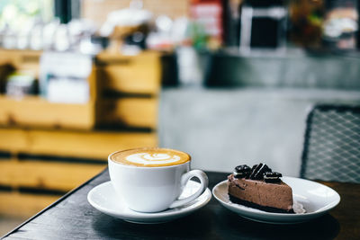 Coffee cup on table at cafe