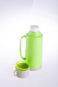 High angle view of green bottle against white background