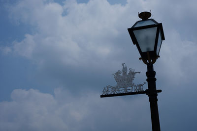 Low angle view of street light against sky