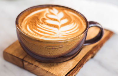 Close-up of cappuccino on table