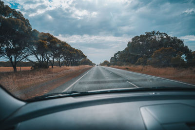 Country road seen through car windshield