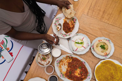 Black woman eating arabic food