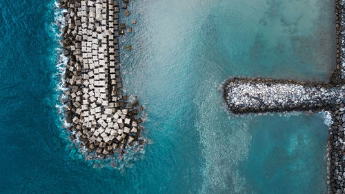 Aerial view of groyne in sea