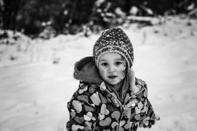 Portrait of smiling boy in snow